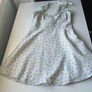 Fit and flair floral dress with buttons in front and ruched detailing